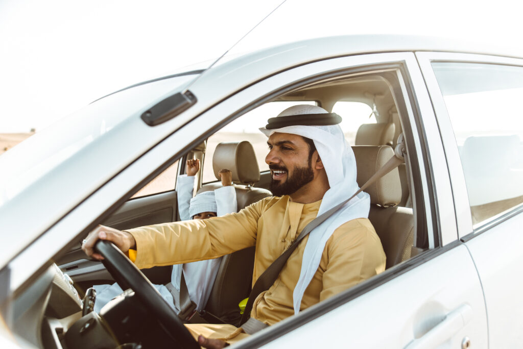 father and son spending time,driving in the desert